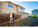Private backyard with wooden fence and patio at 2105 Coronado Pkwy # C, Denver, CO 80229