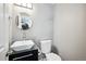 Clean bathroom with updated vanity and toilet at 2105 Coronado Pkwy # C, Denver, CO 80229