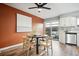 Dining area with a round table and access to a patio at 2105 Coronado Pkwy # C, Denver, CO 80229
