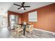 Dining area with a round table and an accent wall at 2105 Coronado Pkwy # C, Denver, CO 80229