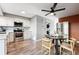 Modern kitchen with white cabinets and stainless steel appliances at 2105 Coronado Pkwy # C, Denver, CO 80229