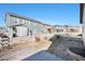 Spacious fenced backyard with a patio and views of neighboring homes at 7285 S Titus Way, Aurora, CO 80016