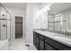 Modern bathroom with double vanity, shower, and separate bathtub at 7285 S Titus Way, Aurora, CO 80016