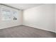 Cozy bedroom with plush carpeting and large windows for natural light at 7285 S Titus Way, Aurora, CO 80016