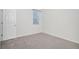 Spacious bedroom with carpet flooring and a single window at 7285 S Titus Way, Aurora, CO 80016