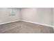 Empty bedroom with neutral carpet and a window with blinds at 7285 S Titus Way, Aurora, CO 80016