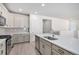 Stylish kitchen with a large island, modern fixtures, and plenty of counter space at 7285 S Titus Way, Aurora, CO 80016