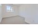 Bright bedroom with carpet flooring and a window offering natural light at 11575 Toccata Trl, Parker, CO 80134