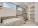 Elegant bathroom with soaking tub, walk-in shower, and modern finishes at 11575 Toccata Trl, Parker, CO 80134