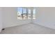 Well-lit bedroom with carpet flooring and multiple windows at 11575 Toccata Trl, Parker, CO 80134