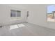Bright bedroom featuring light wood-look flooring and large windows at 11575 Toccata Trl, Parker, CO 80134