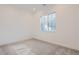 Well-lit bedroom featuring carpet and a window at 11575 Toccata Trl, Parker, CO 80134