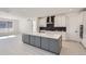 Modern kitchen with a large island and dark gray cabinetry at 11575 Toccata Trl, Parker, CO 80134