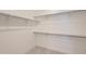 Large walk-in closet with double hanging rods and shelving at 11575 Toccata Trl, Parker, CO 80134