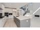 Modern kitchen featuring a large island and stainless steel appliances at 11575 Toccata Trl, Parker, CO 80134