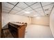 Finished basement bar area with a built-in bar and seating at 1830 Simms St, Lakewood, CO 80215