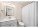 Clean bathroom, featuring a white vanity and shower at 1830 Simms St, Lakewood, CO 80215