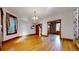 Hardwood floors and views into kitchen and entryway at 2225 N Ogden St, Denver, CO 80205