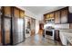 Modern kitchen with stainless steel appliances and barn door at 2225 N Ogden St, Denver, CO 80205