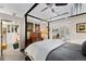 Main bedroom with a four-poster bed and walk-in closet at 1610 Little Raven St # 407, Denver, CO 80202