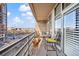 Private balcony with city views and seating area at 1610 Little Raven St # 407, Denver, CO 80202