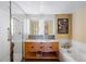Elegant bathroom with double vanity, soaking tub, and walk-in shower at 1610 Little Raven St # 407, Denver, CO 80202