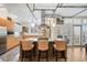 Modern kitchen with island, stainless steel appliances, and light wood cabinets at 1610 Little Raven St # 407, Denver, CO 80202