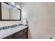 Bathroom with vanity, mirror, and mosaic tile accents at 3953 S Killarney Way, Aurora, CO 80013