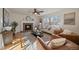 Living room with a fireplace, hardwood floors, and comfy seating at 7459 S Lewiston St, Aurora, CO 80016