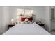 Bedroom with a queen bed and en-suite bathroom at 15881 Willow Way, Thornton, CO 80602