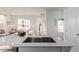 Modern kitchen with island and large sink at 15881 Willow Way, Thornton, CO 80602