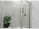 Clean shower with glass enclosure and neutral tile at 15881 Willow Way, Thornton, CO 80602