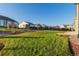 Large backyard with a grassy area and mature trees at 15881 Willow Way, Thornton, CO 80602