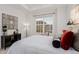 Spacious bedroom with a king-size bed and large window at 15881 Willow Way, Thornton, CO 80602