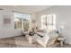 Bright living room with comfy seating and large windows at 15881 Willow Way, Thornton, CO 80602