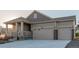 Two-story home with attached two-car garage and landscaped front yard at 15881 Willow Way, Thornton, CO 80602