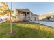 Two-story house with a front porch and attached two car garage at 15881 Willow Way, Thornton, CO 80602