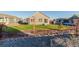 Landscaped backyard with grassy area, and mature trees at 15881 Willow Way, Thornton, CO 80602