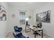 Home office with desk, two chairs, and large window at 15881 Willow Way, Thornton, CO 80602