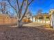 Backyard with covered patio and mature shade tree at 1130 Locust St, Denver, CO 80220