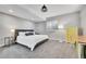 Basement bedroom with a king-size bed, dresser, and window with shutters at 3946 Forever Cir, Castle Rock, CO 80109