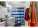Bathroom with shower/tub combo, vanity, and striped shower curtain at 2229 S Bannock St, Denver, CO 80223
