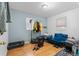 Bedroom with a couch, closet, and wood floors at 2229 S Bannock St, Denver, CO 80223