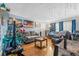 Living room with hardwood floors, couches, Christmas tree, and TV at 2229 S Bannock St, Denver, CO 80223