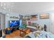 Living room with hardwood floors, a Christmas tree, and comfortable seating at 2229 S Bannock St, Denver, CO 80223