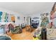 Living room with hardwood floors, couches, Christmas tree, and TV at 2229 S Bannock St, Denver, CO 80223