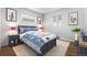 bedroom with blue bed, playful decor, and two windows with blinds at 1155 S Harlan St, Lakewood, CO 80232