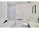 Clean bathroom featuring a bathtub, toilet, and modern vanity with a quartz countertop at 1304 Snowberry Ln # 203, Louisville, CO 80027