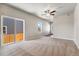 Open living room with sliding glass doors and view of backyard at 7318 Arkansas St, Frederick, CO 80530