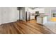 Modern kitchen with stainless steel appliances and hardwood floors at 7318 Arkansas St, Frederick, CO 80530